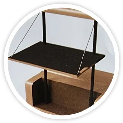 A black shelf sitting on top of a wooden table.